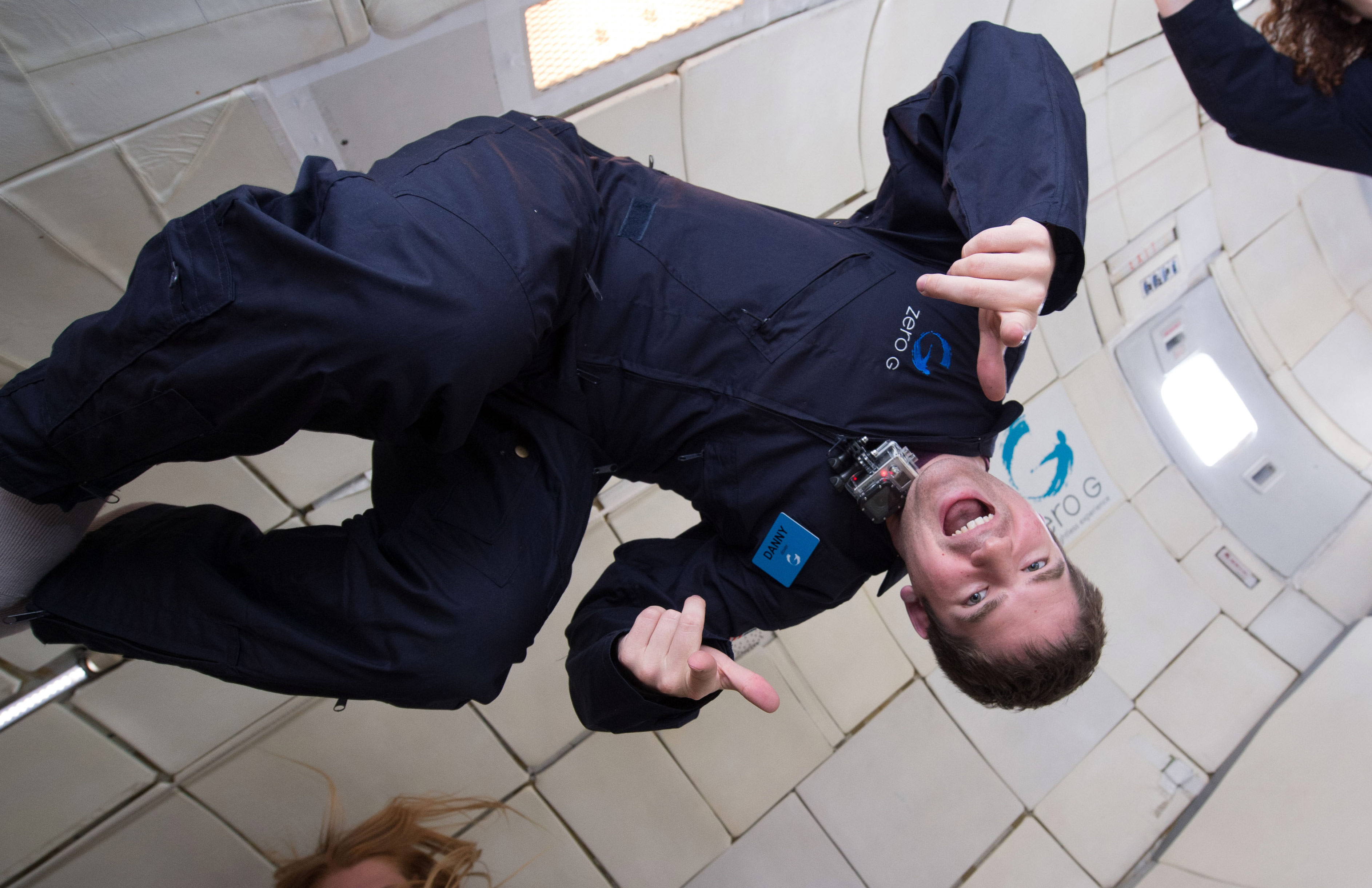 Danny Dover floating upside down during zero-gravity astronaut training